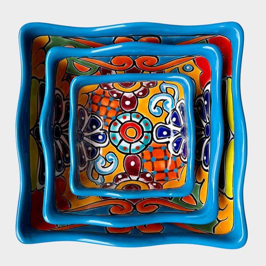 Three colorful talavera square nesting bowls with intricate patterns