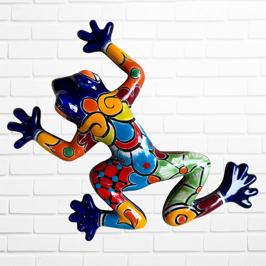 Cobalt blue Talavera wall frog with multicolored designs.