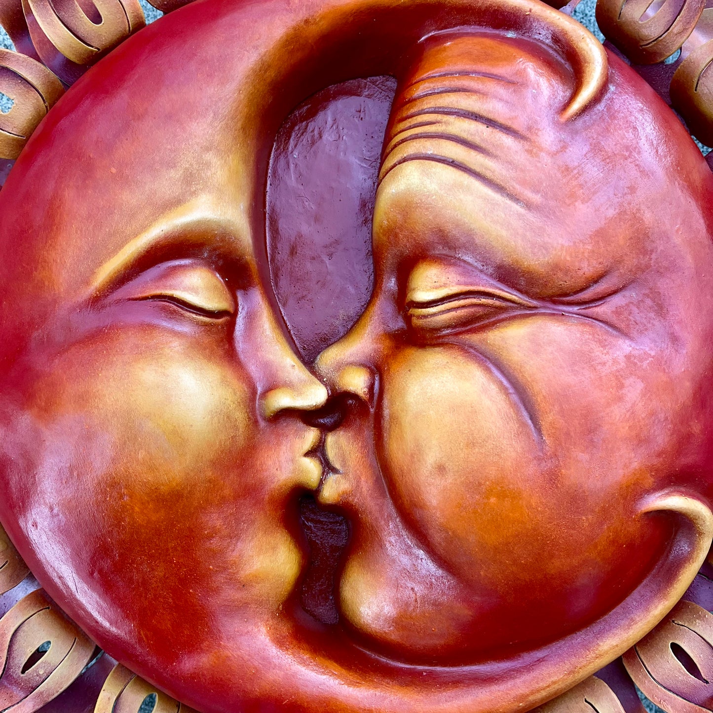 Kissing Sun and Moon Sculpture close up