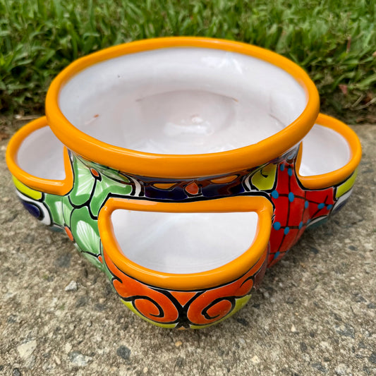 Hand painted Mexican Talavera Strawberry pot with a large top opening a four pockets on each side. Trim color is sunny yellow, body has multi-color designs on each of the four sides.
