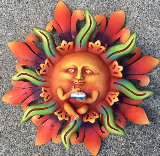 Metal crafted wall reading a book