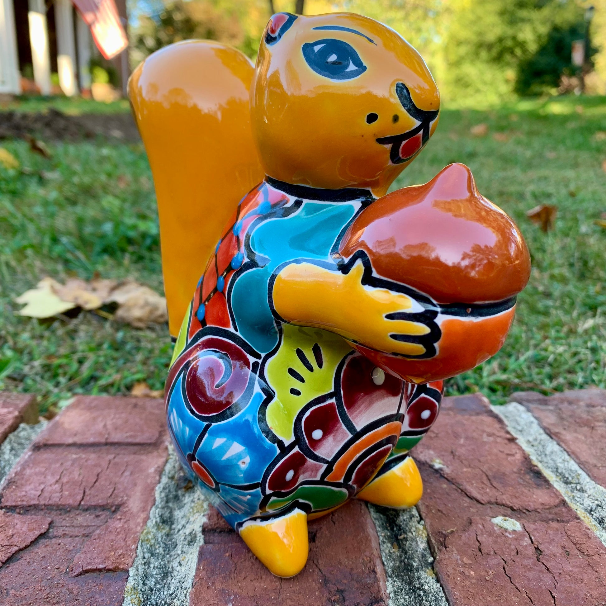 Talavera Squirrel holding nut in Amarillo, yellow