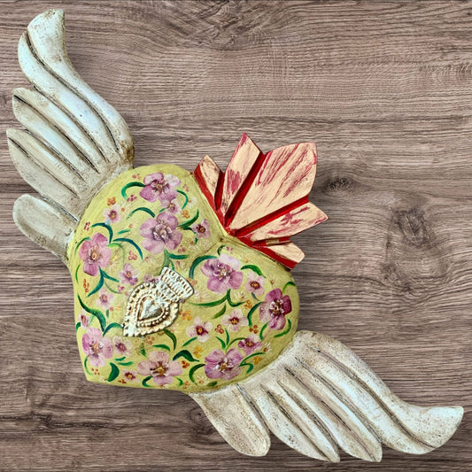 Milagros decorated sacred heart with wings