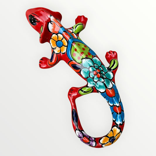 Mexican Talavera wall mounted iguana in bright red with multicolor designs.