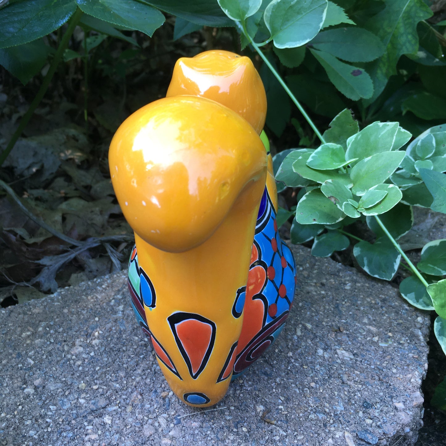 Talavera squirrel holding nut back