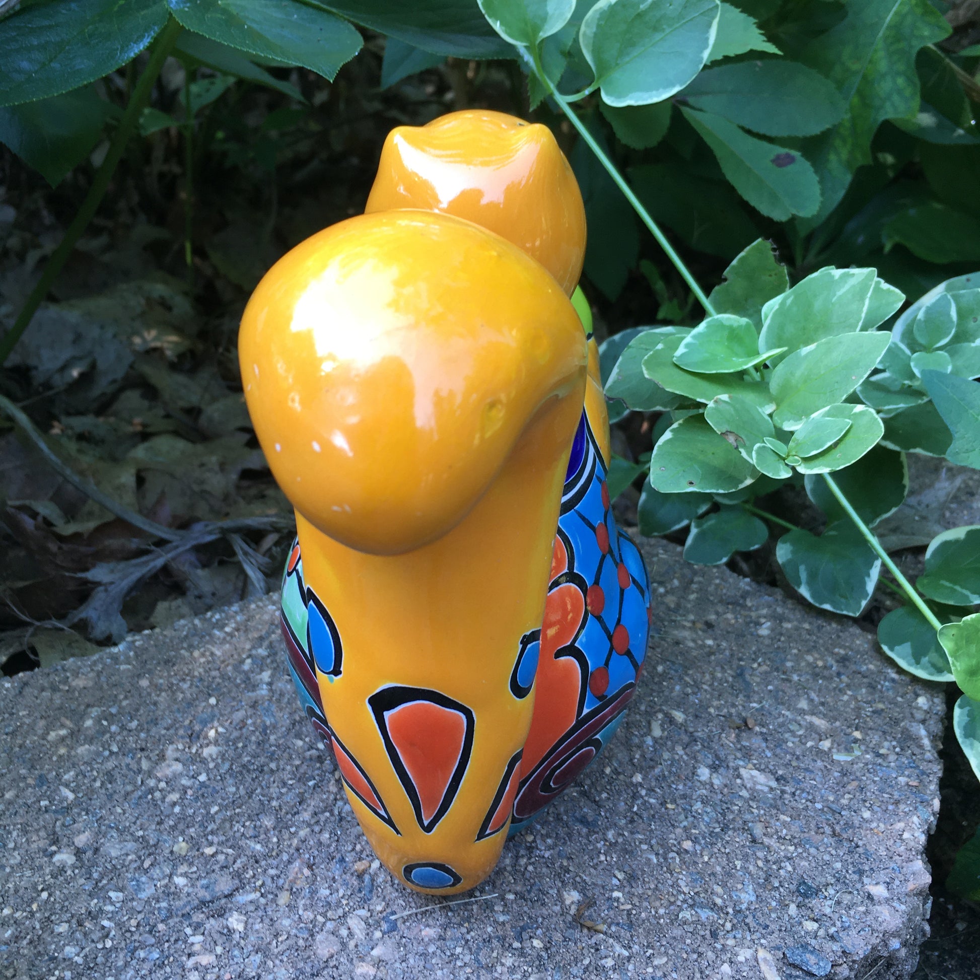Talavera squirrel holding nut back
