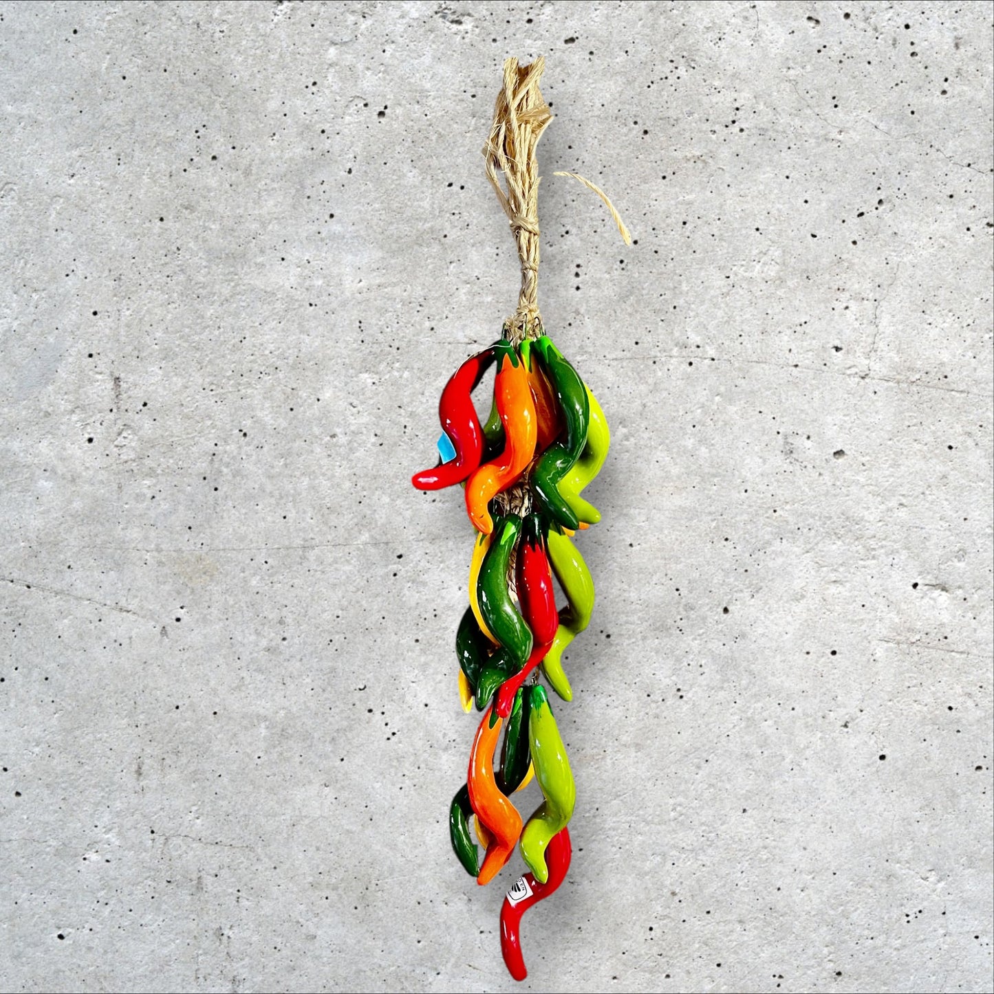 Curly multicolored chili peppers string