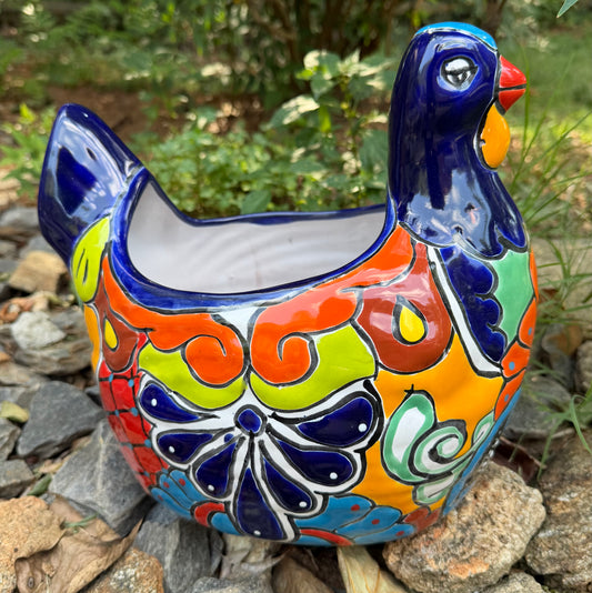 Colorful Mexican Talavera ceramic chicken shape planter on a natural background