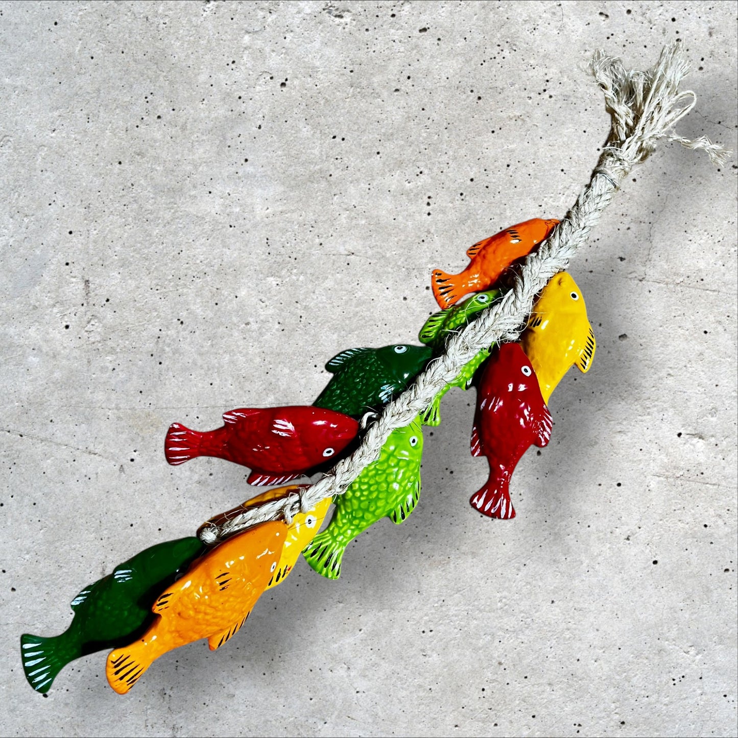 Ceramic colorful fish on a string back