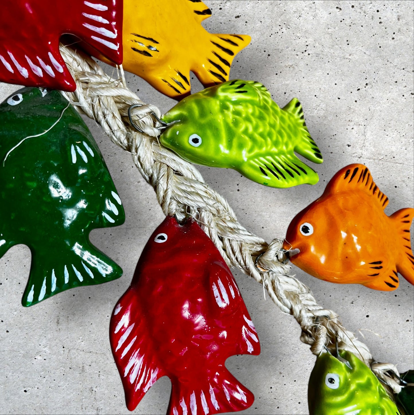 Ceramic tropical fish on a string attachment