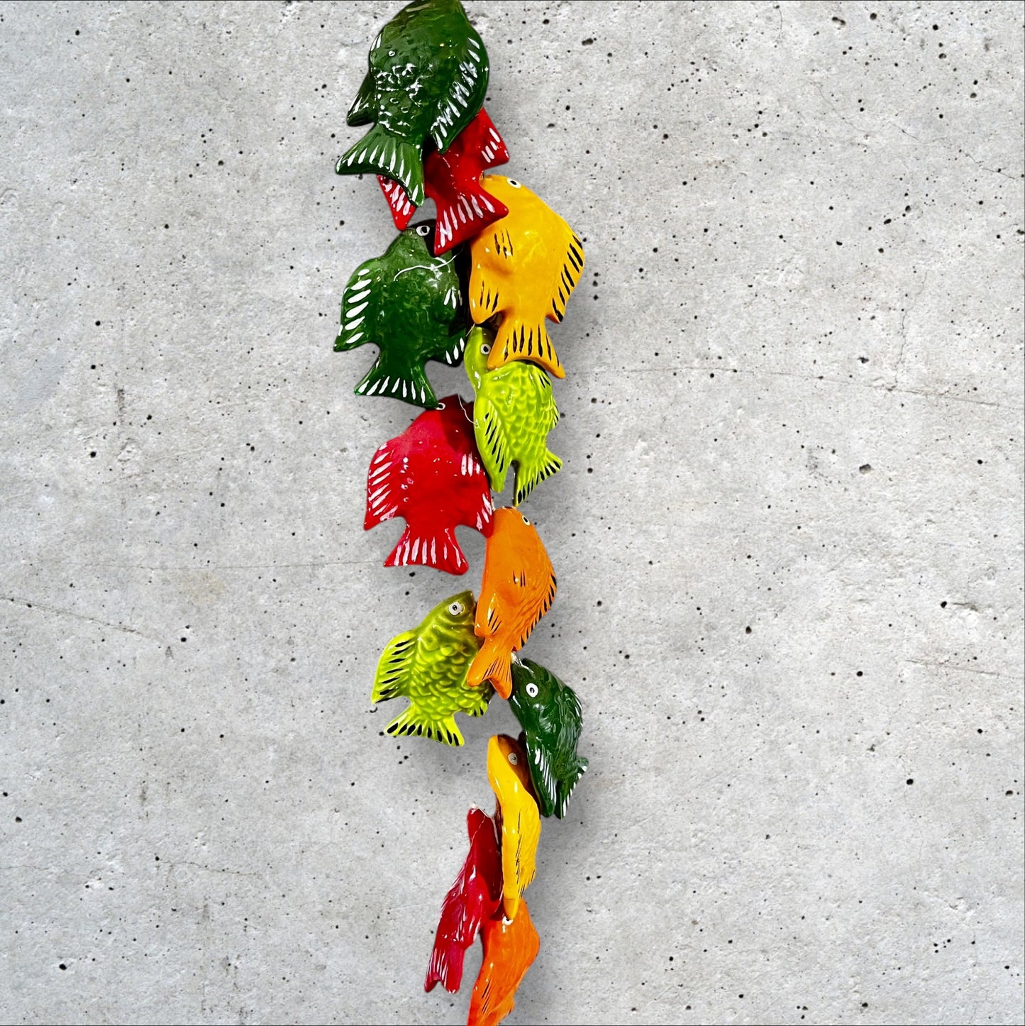 Ceramic tropical fish on a string bundle