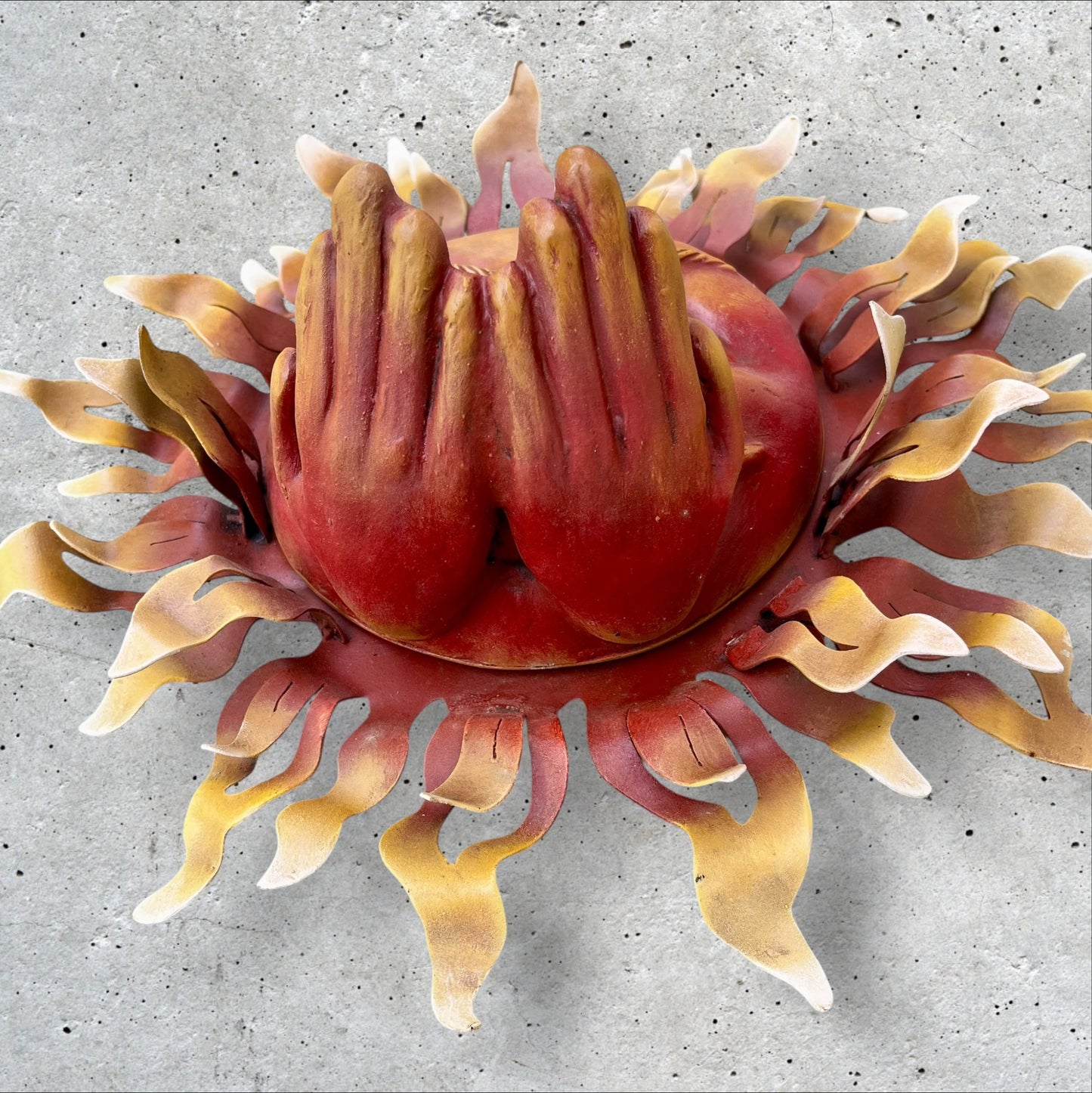 Metal wall art sun with hands bottom of hands