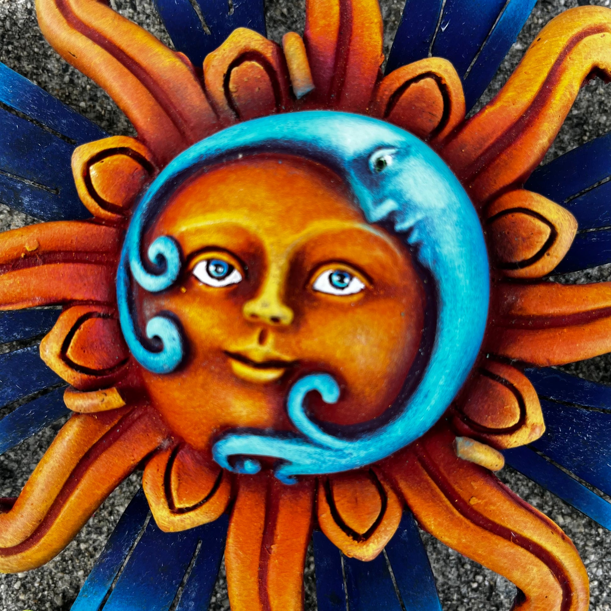 Sun with blue moon wall art face close up