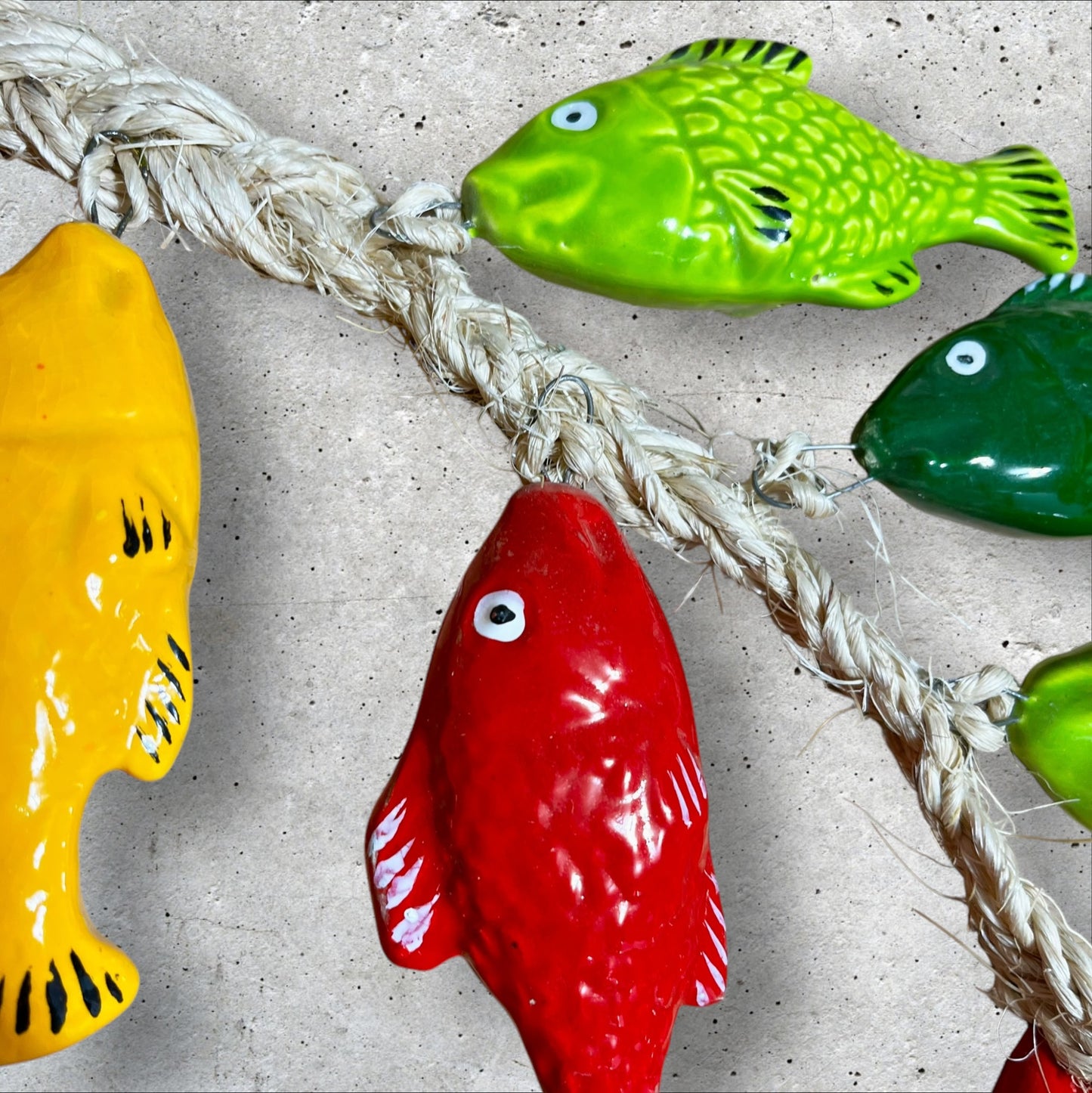 Ceramic colorful fish on a string attached