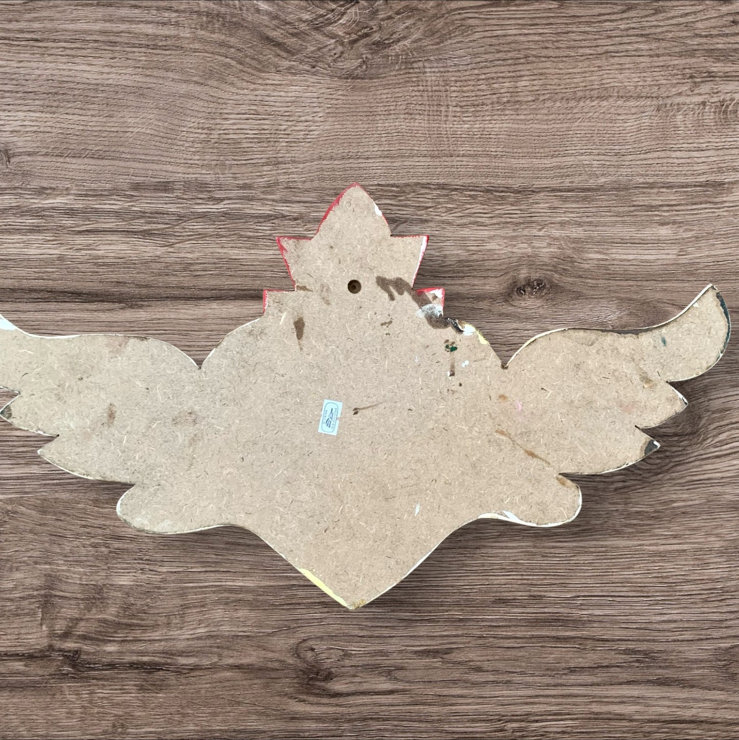 Milagros decorated sacred heart with wings back