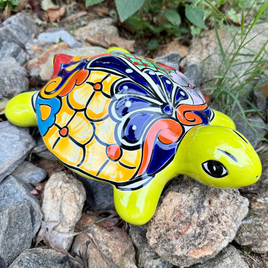 Mexican Talavera Colorful turtle-shaped object on a rocky surface