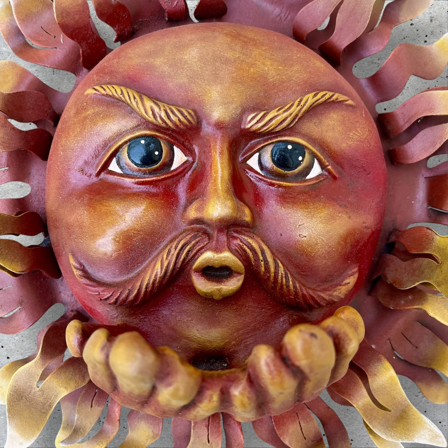 Metal wall art sun with hands face