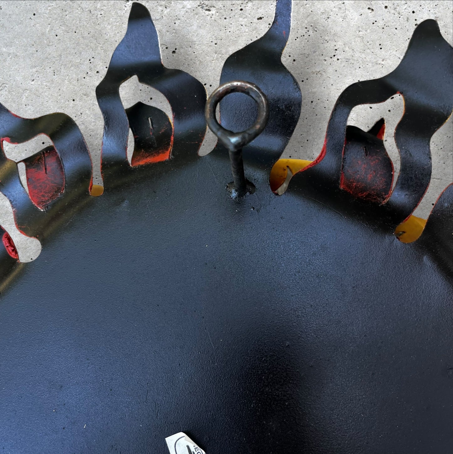 Metal wall art sun with hands hanging loop