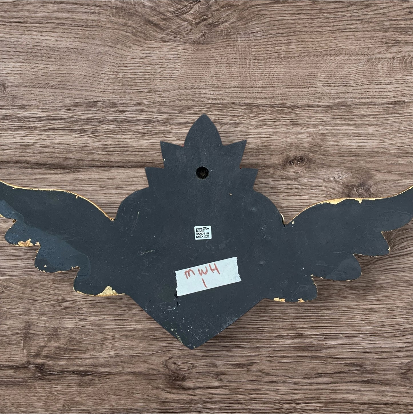 Milagros decorated sacred heart with wings back