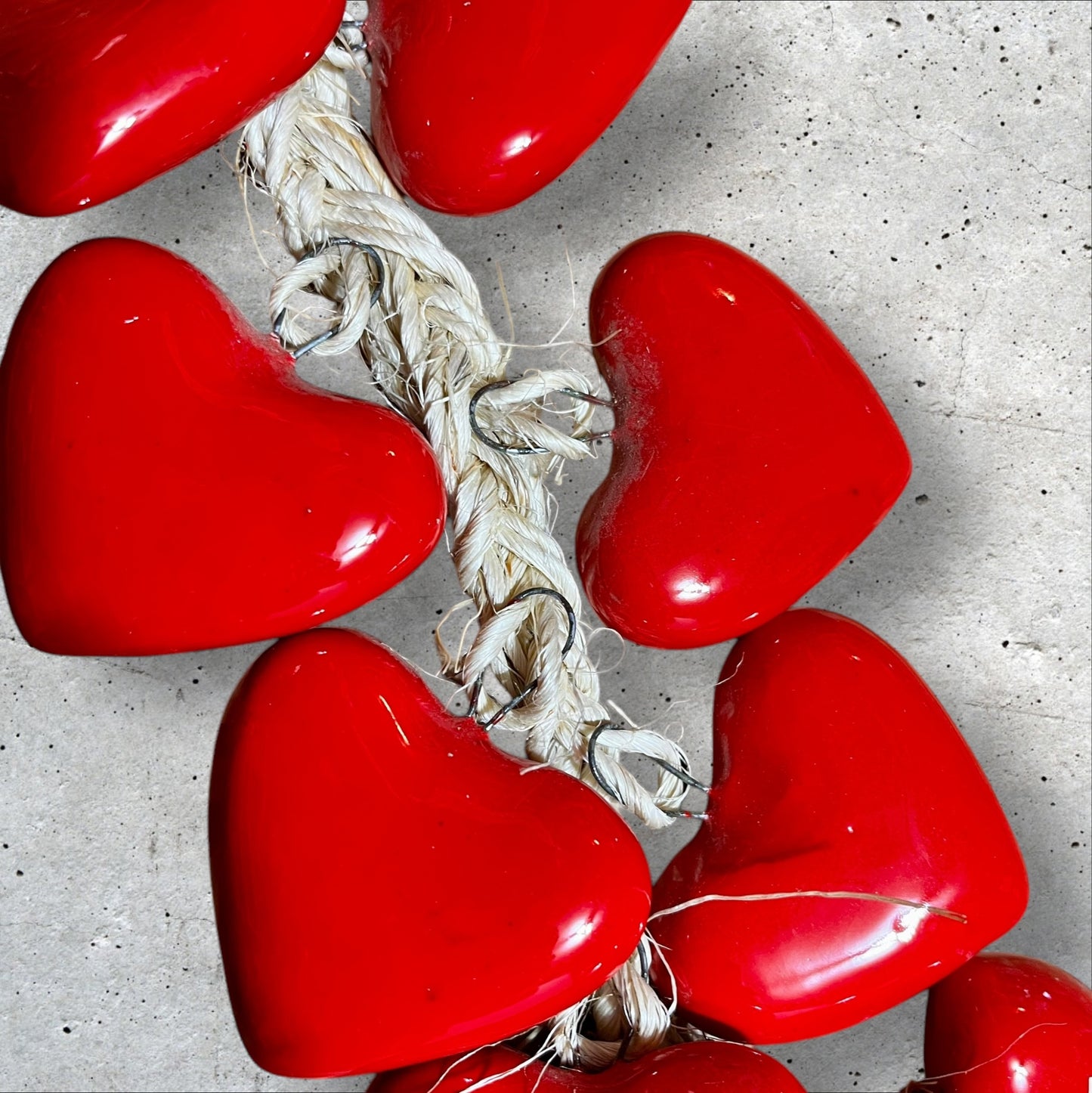 Ceramic string of hearts attached to rope