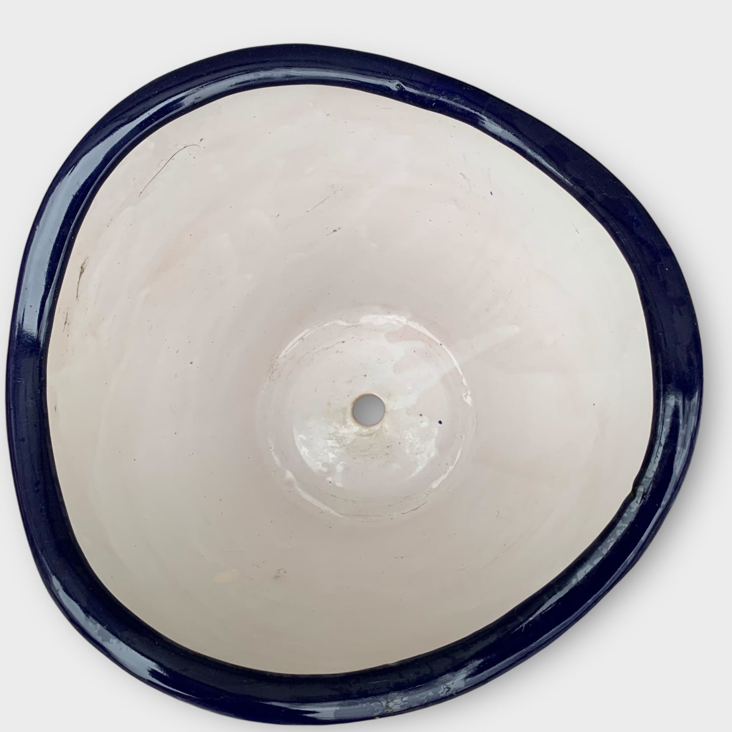 Mexican Talavera planting pot top view showing the drain hole