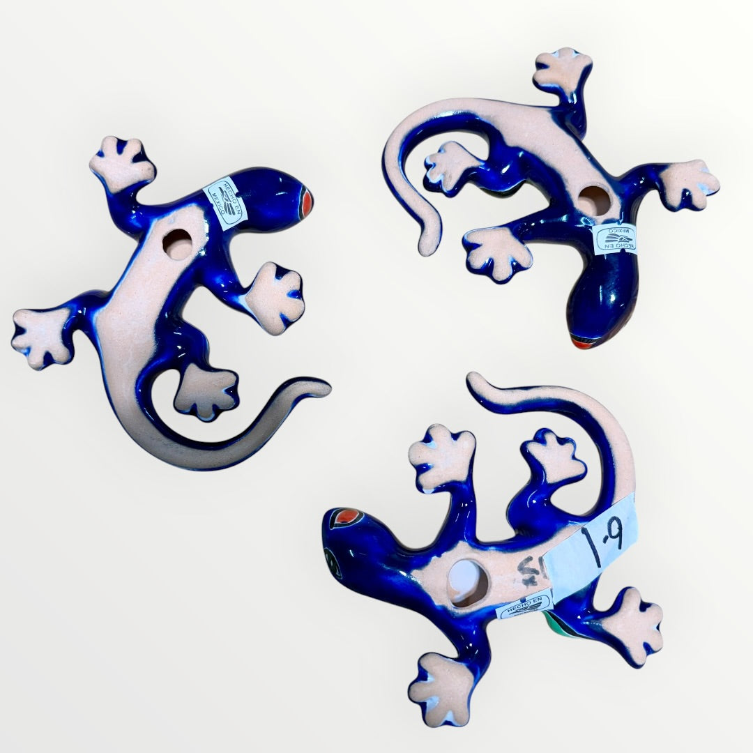 Three colorful ceramic lizards on a white background Bottom
