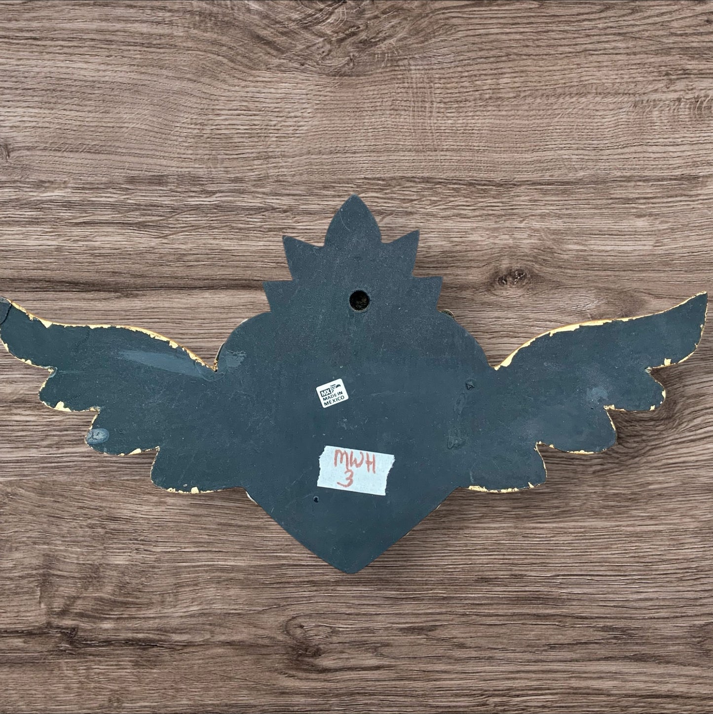 Milagros decorated sacred heart with wings back