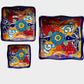 Three colorful talavera square nesting bowls with intricate patterns Shown unnested.