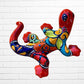 Colorful lizard-shaped sculpture against a white brick wall background left side