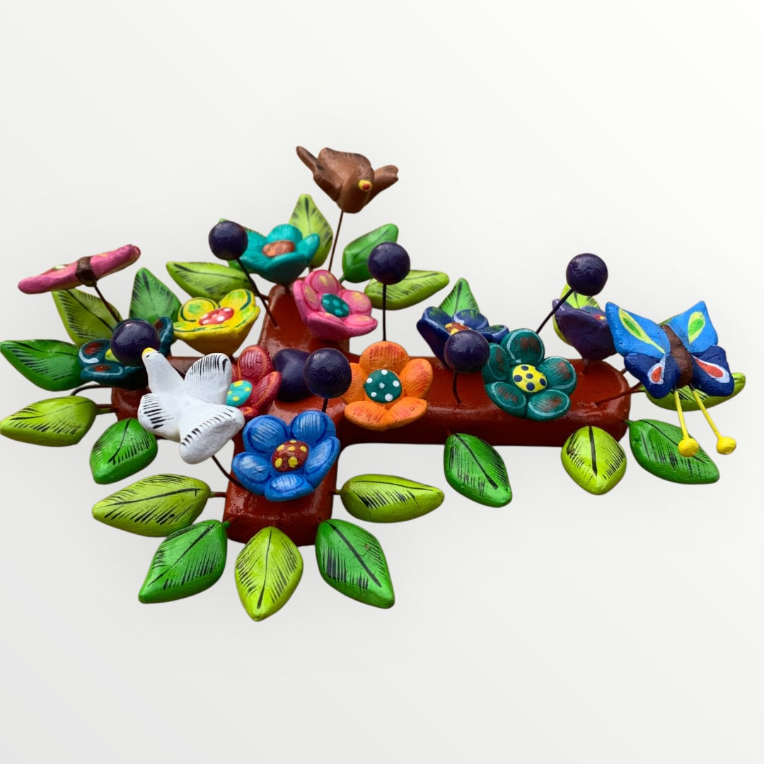 Ortega Family Folk Art Cross with colorful flowers, leaves, birds and butterflies. Cross base is a red color Side 3D view