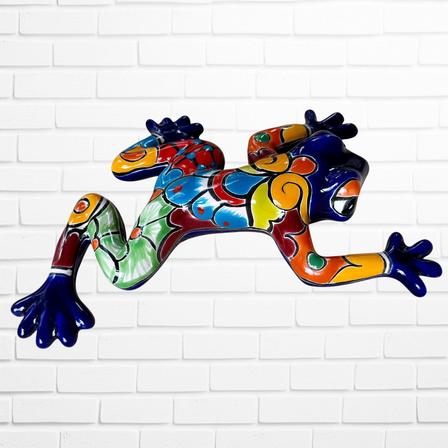 Cobalt blue Talavera Pottery wall, frog left side view with multicolored design designs