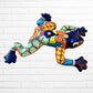 Colorful blue ceramic frog wall art on a white brick wall left side
