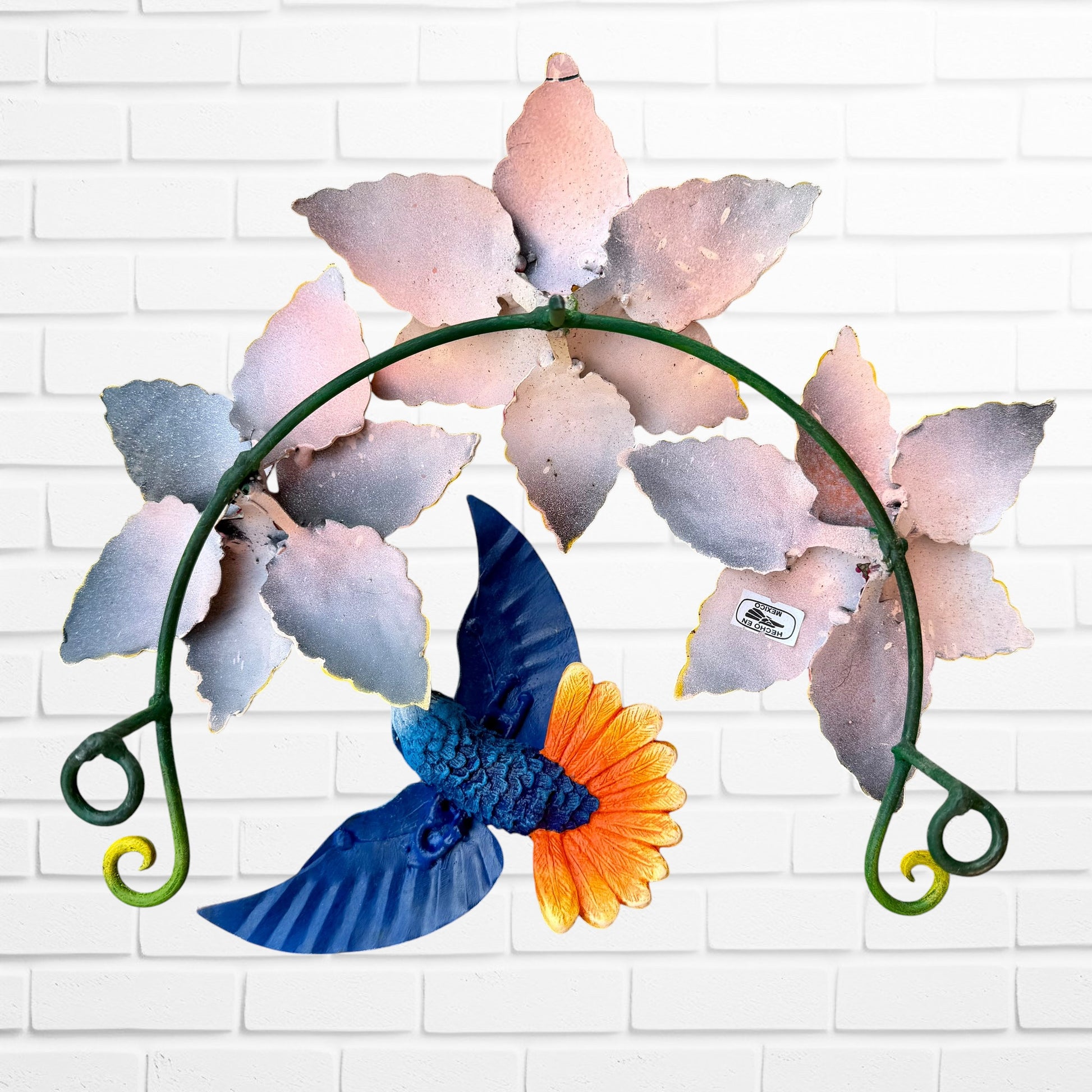 Metal hummingbird sculpture with Vibrant yellow flowers BAck View