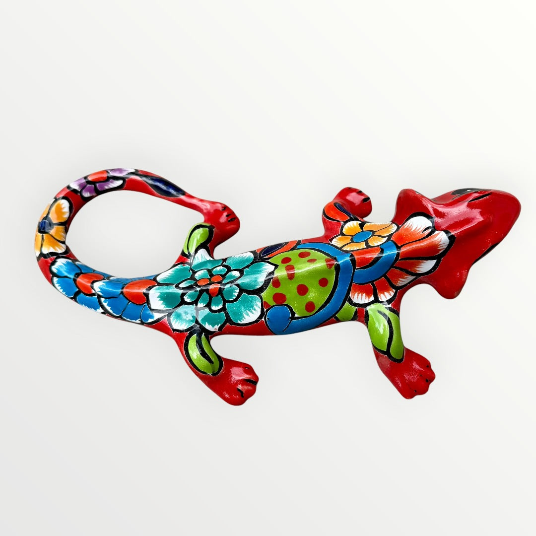 Mexican Talavera wall mounted iguana in bright red with multicolor designs left side view