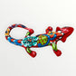 Mexican Talavera wall mounted iguana in bright red with multicolor designs left side view