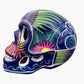 Colorful Mexican Sugar skull purple with vibrant designs on a white background Side view
