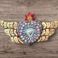 Winged Milagros sacred heart with center heart charm surrounded by sea shells Front