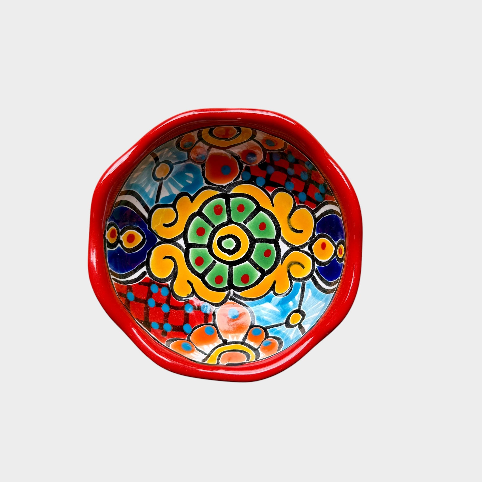 Three colorful talavera nesting bowls with intricate patterns Small bowl