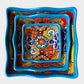 Three colorful talavera square nesting bowls with intricate patterns