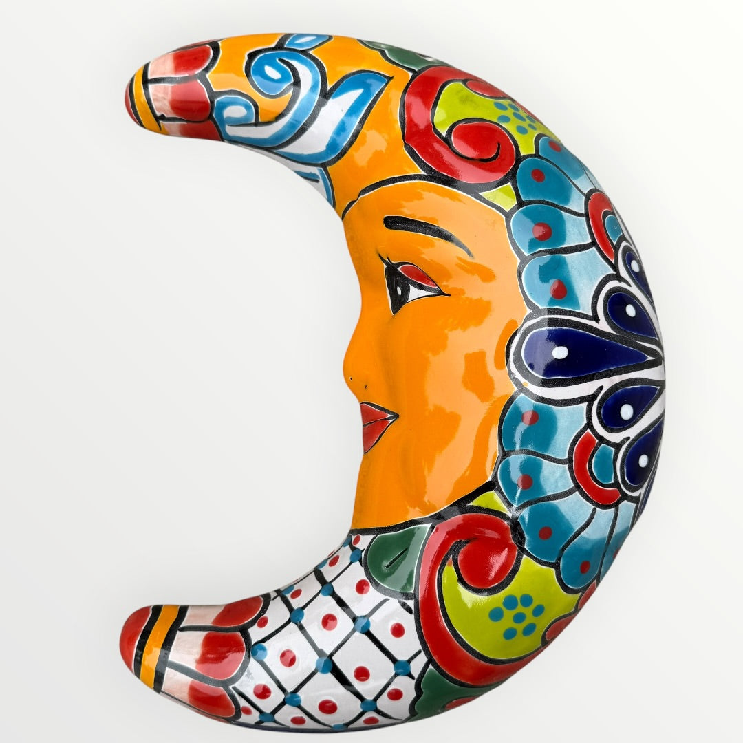 Decorative ceramic moon with colorful patterns on a white background