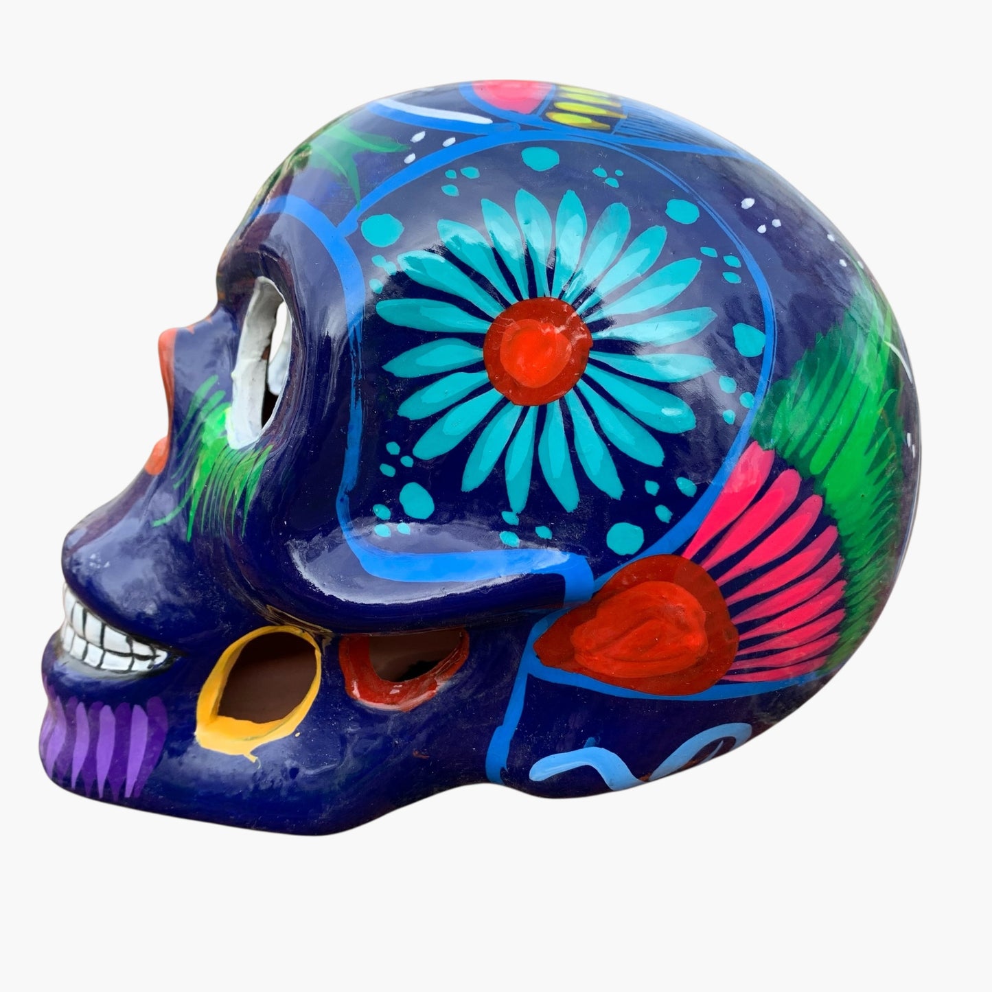 Mexican sugar skull purple with colorful, multicolor design side view
