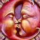 Kissing Sun and Moon Sculpture close up
