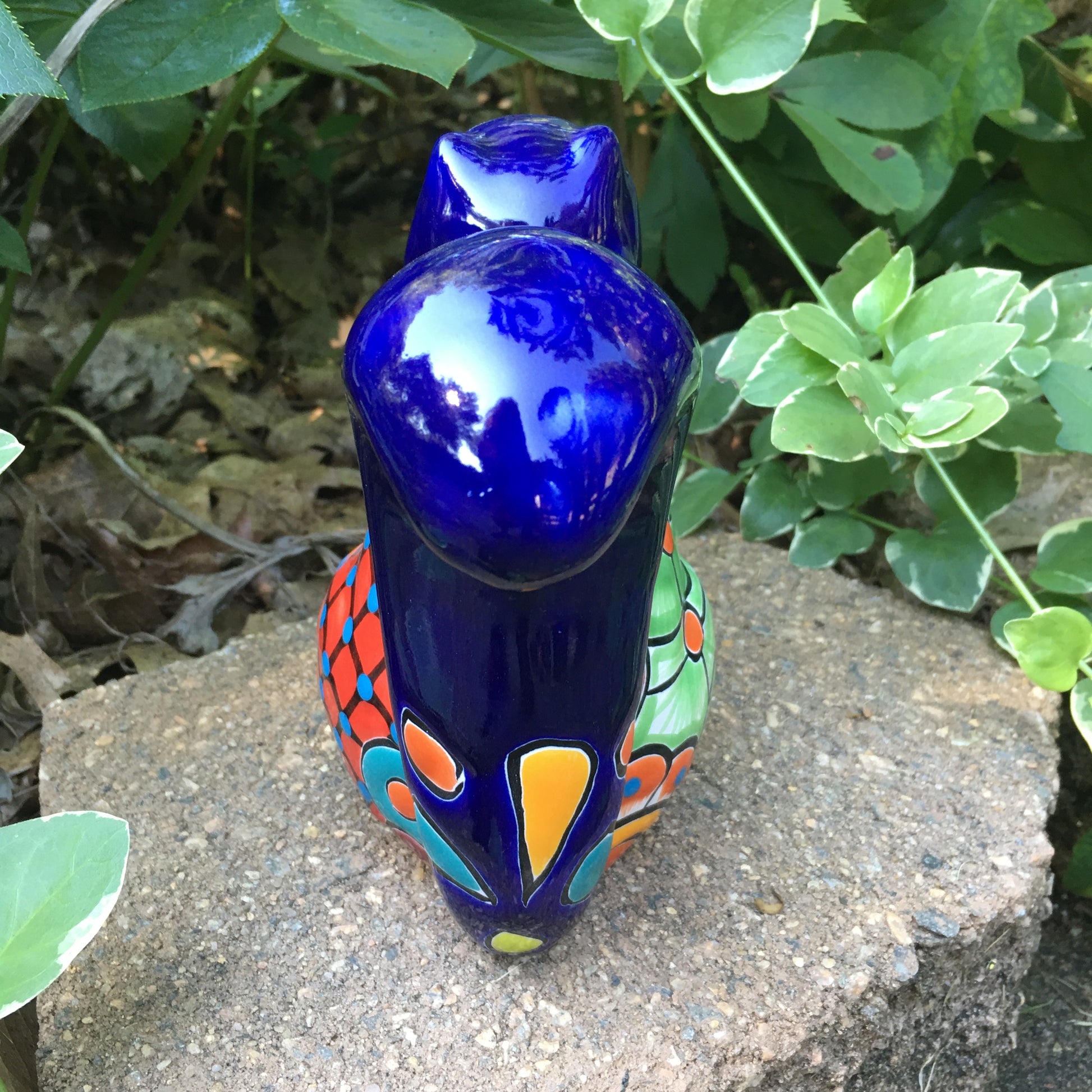 Talavera squirrel holding nut back