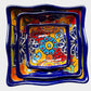 Three colorful talavera square nesting bowls with intricate patterns