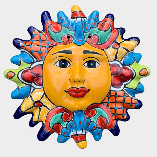 Decorative Talavera sun-shaped wall art with colorful face design on a white background