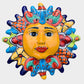 Decorative Talavera sun-shaped wall art with colorful face design on a white background