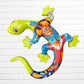 A colorful decorative lizard Talavera wall sculpture with a hand-painted floral and geometric pattern, mounted against a white brick wall.