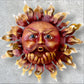 Metal wall art sun with hands