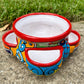 Hand painted Mexican Talavera Strawberry pot with a large top opening a four pockets on each side.  Trim color is cherry red, body has multi-color designs on each side.