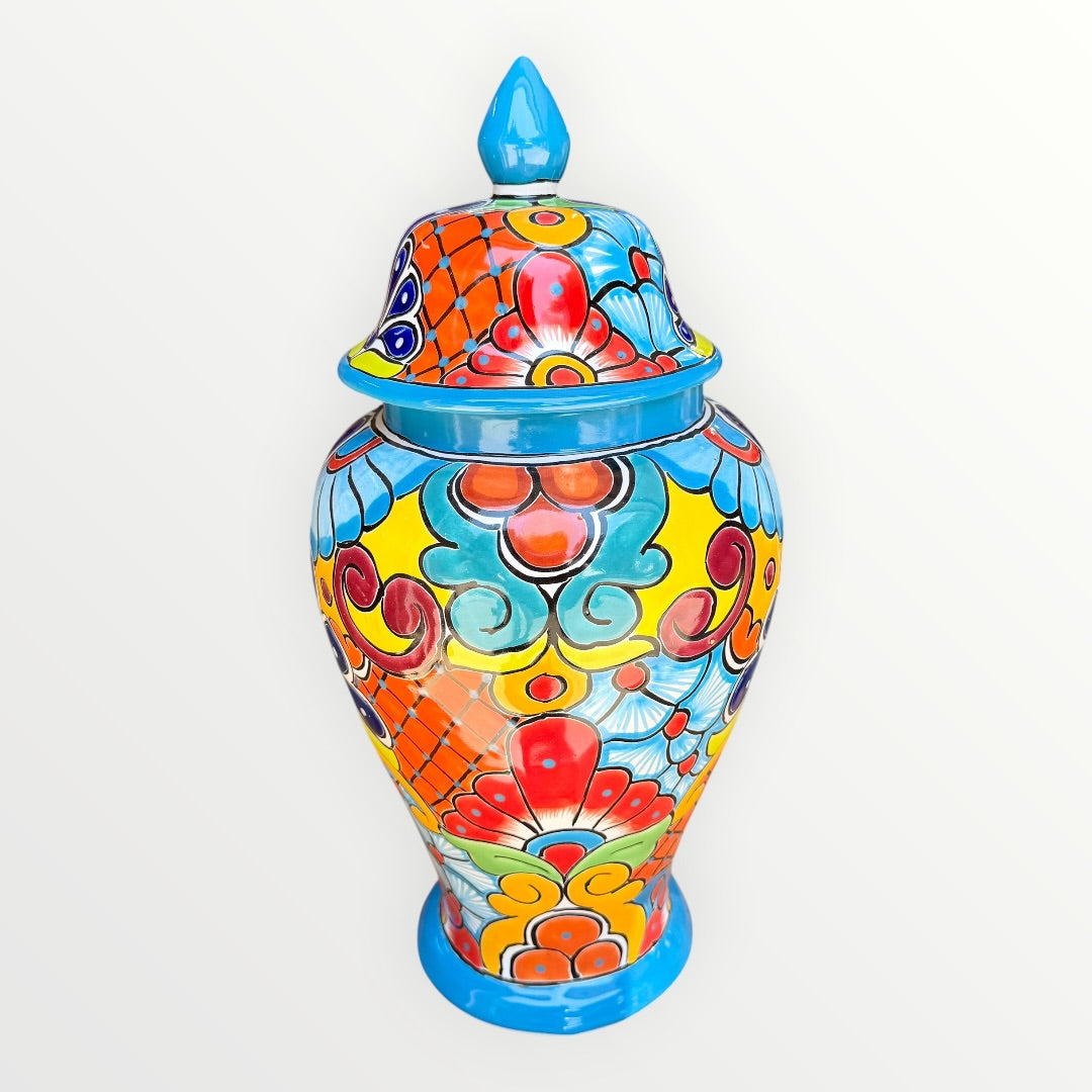 Colorful Mexican Talavera ceramic jar with lid decorated with intricate multicolor traditional patterns Other side